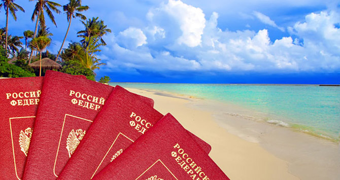 International passports of Russia against a tropical beach