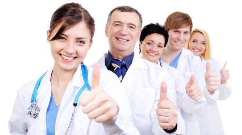 Medical doctors giving thumbs-up